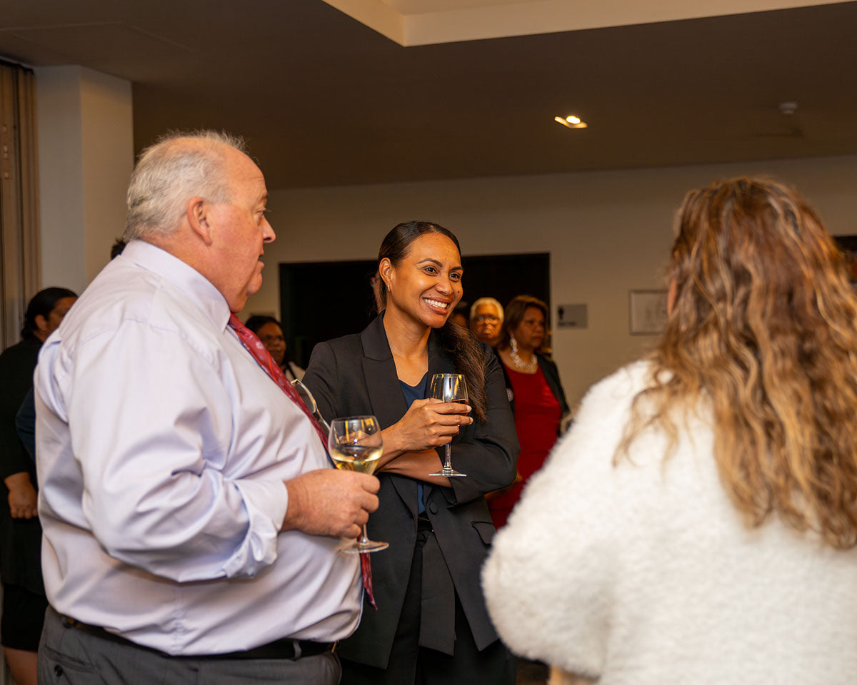 Industry representatives holding drinks and engaging in lively conversation as guests gather for the gala event.