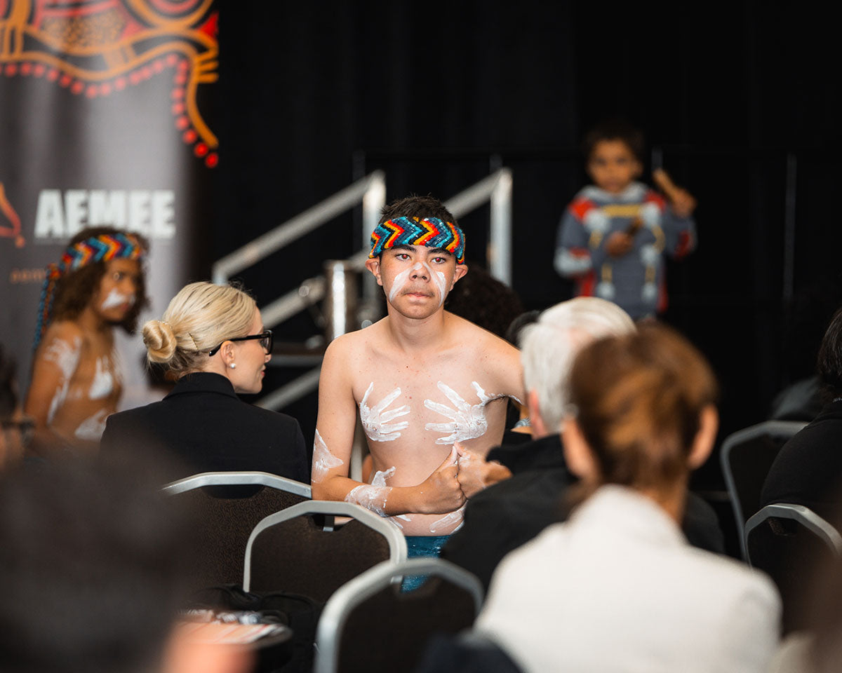 Indigenous youth dancer with traditional body paint performing at the AEMEE 2024 Annual Conference Day 1, Fremantle Western Australia