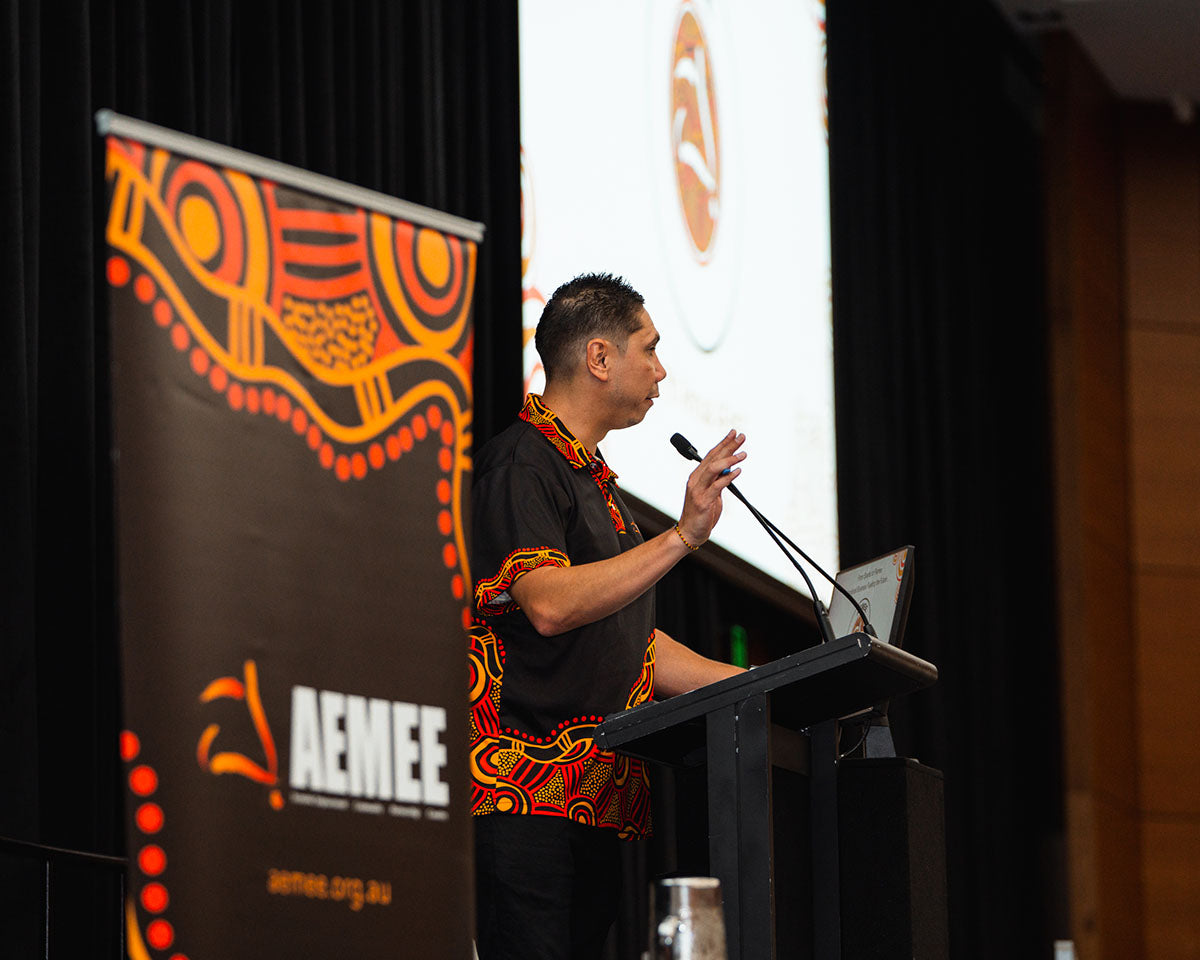 Jyi Lawton, CEO of AEMEE, presenting at the AEMEE 2024 Annual Conference Day 1 — From Sparks to Flames, Fremantle Western Australia