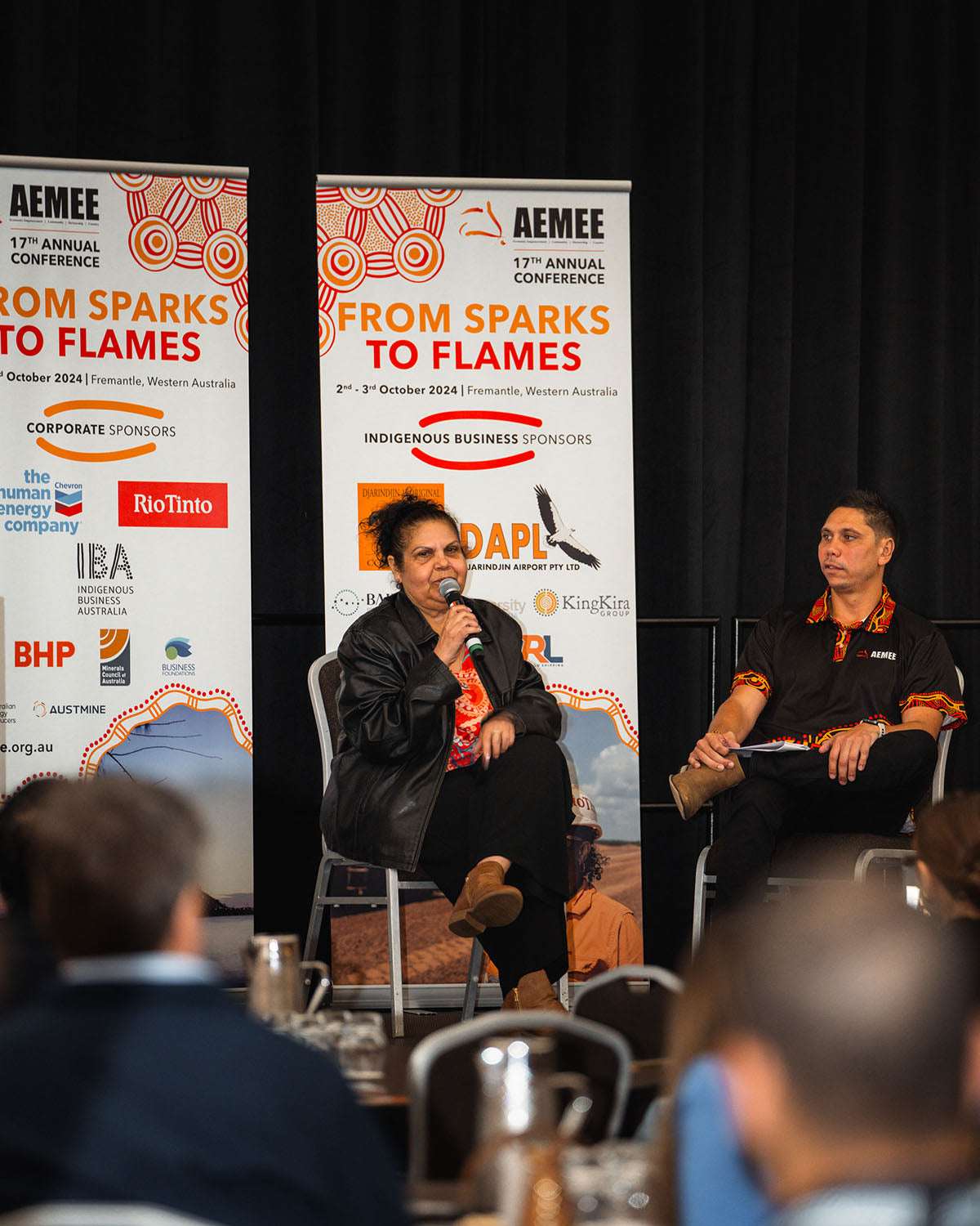 Speakers in discussion on stage at the AEMEE 2024 Annual Conference Day 1 — From Sparks to Flames, Fremantle Western Australia