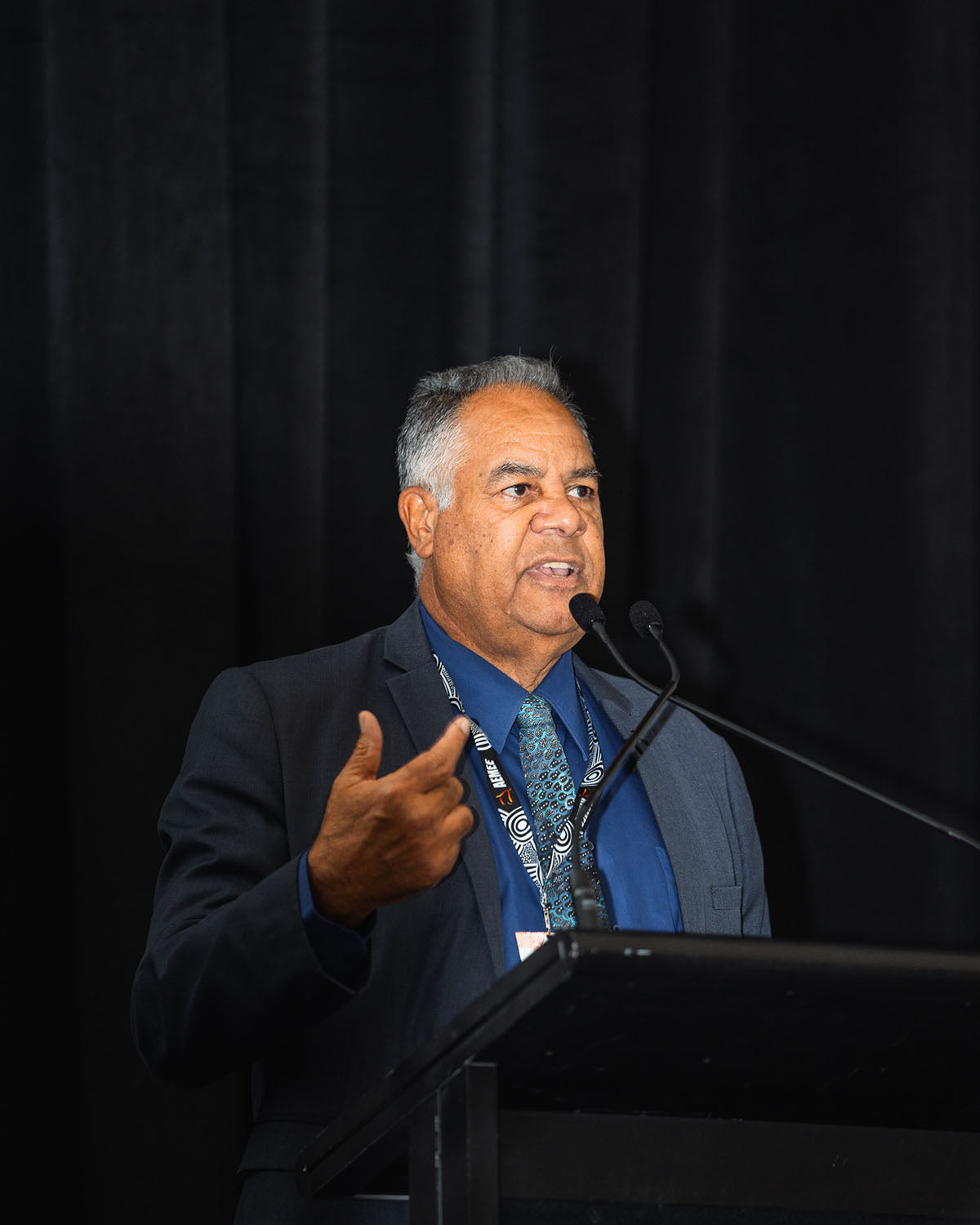 Speaker at the podium at the AEMEE 2024 Annual Conference Day 1 — From Sparks to Flames, Fremantle Western Australia