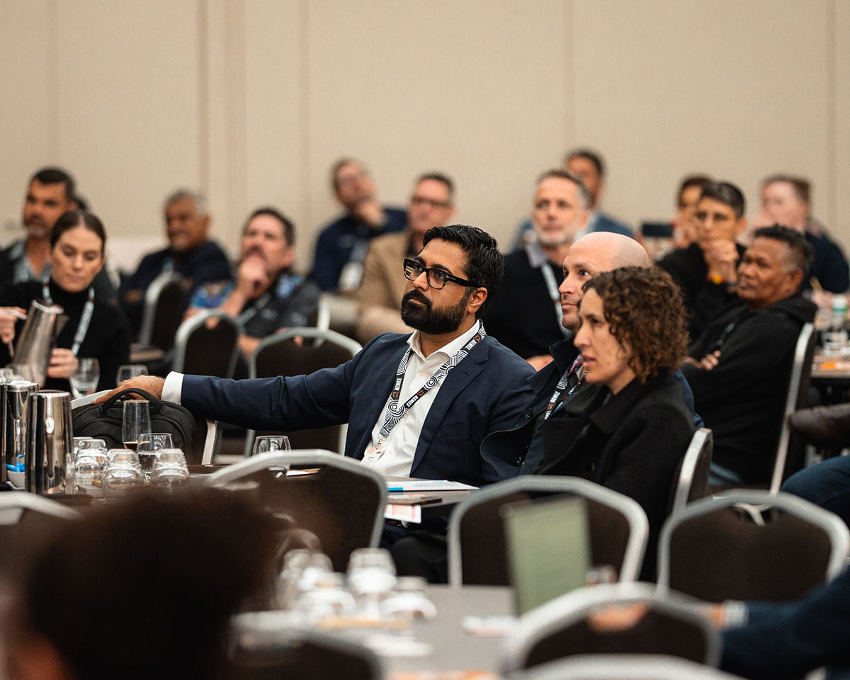 Keynote speakers seated and listening during a conference session at the 2024 AEMEE Annual Conference in Fremantle, WA.