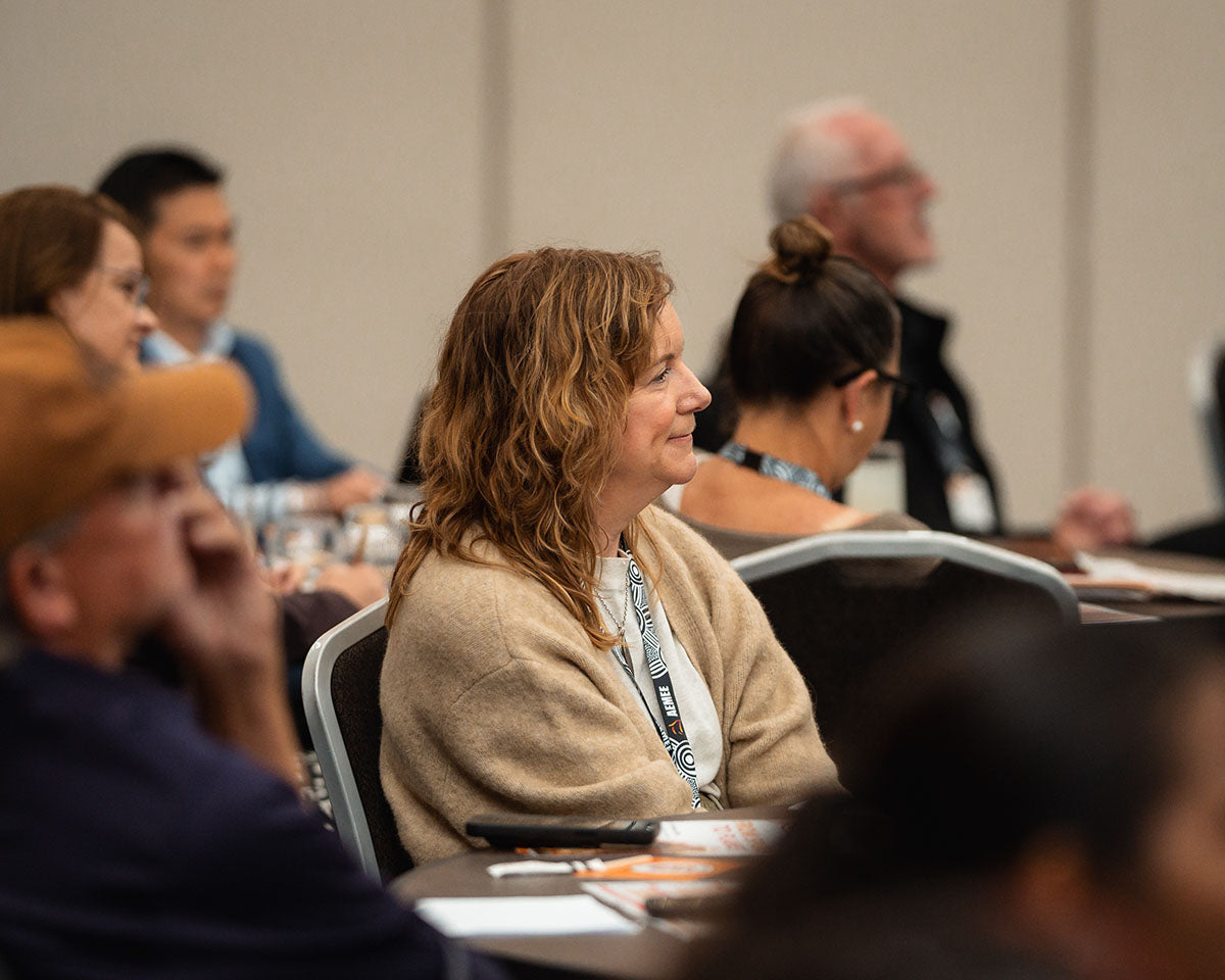 Delegates watching a presentation during Session 2: Tracking the Journey at the 2024 AEMEE Annual Conference.