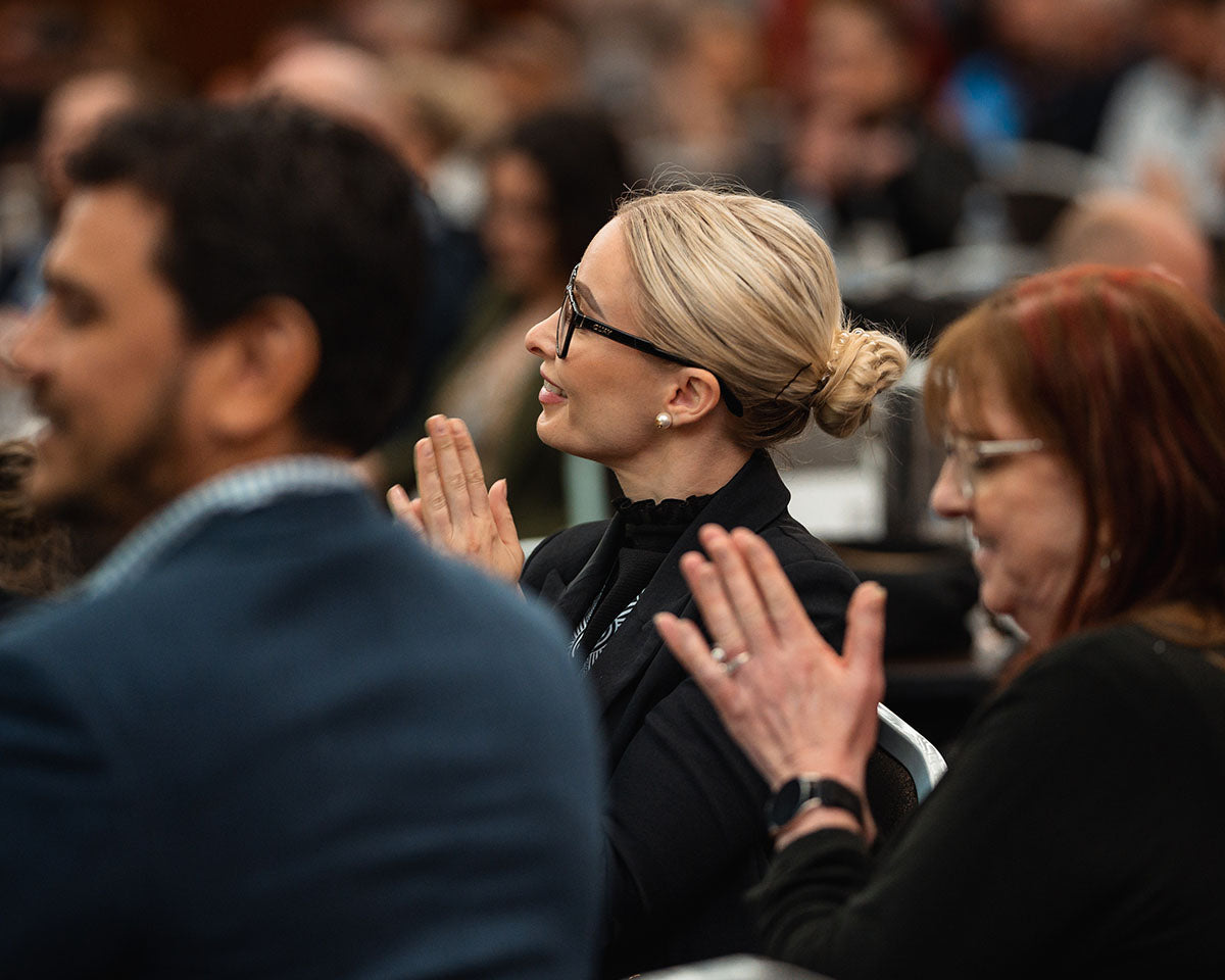Delegate applauding during a session at the 2024 AEMEE Annual Conference in Fremantle, WA.