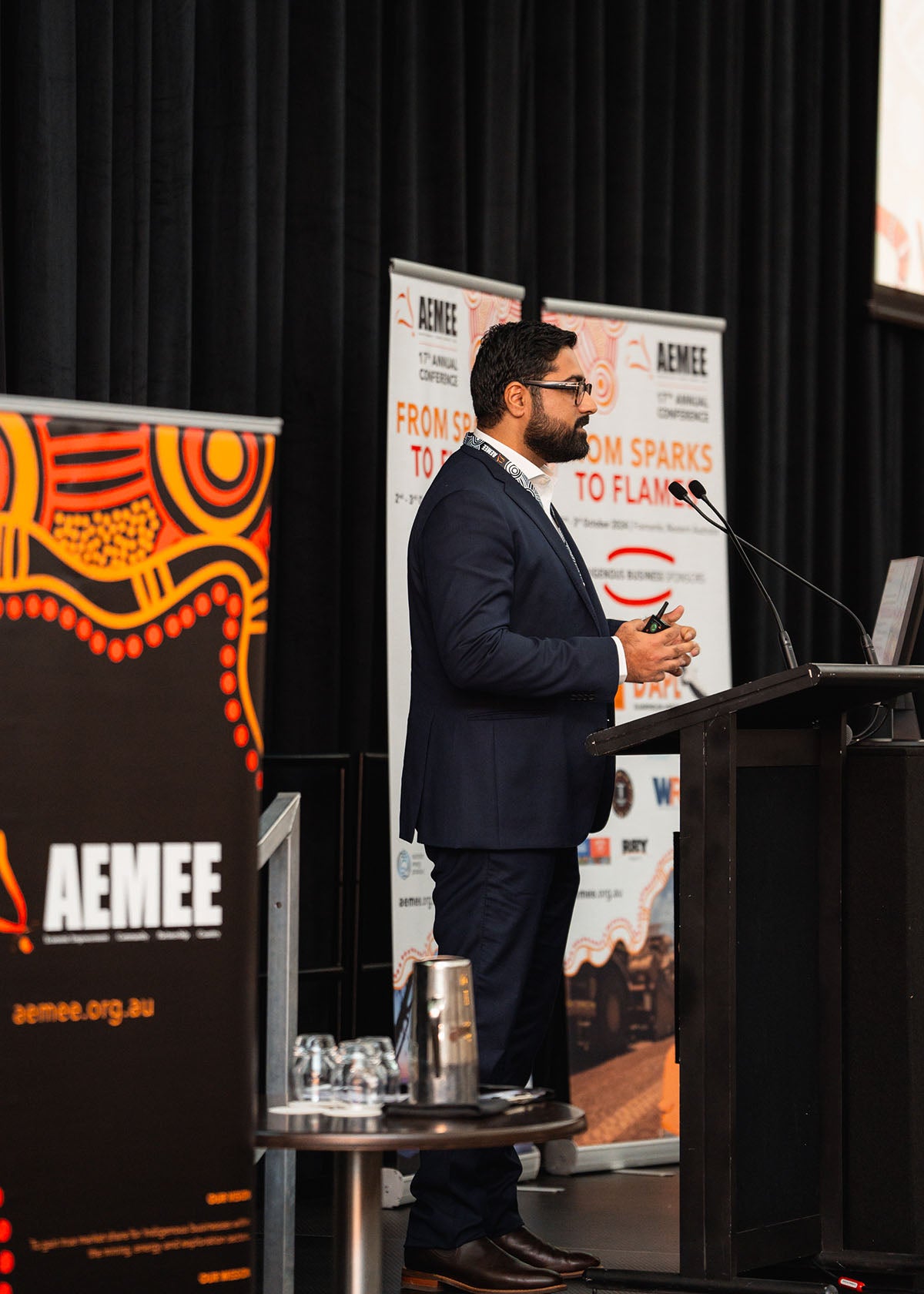 Gohar Rhind of the Waalitj Foundation speaking with hand gestures during a dedicated technical stream presentation at the 2024 AEMEE conference.