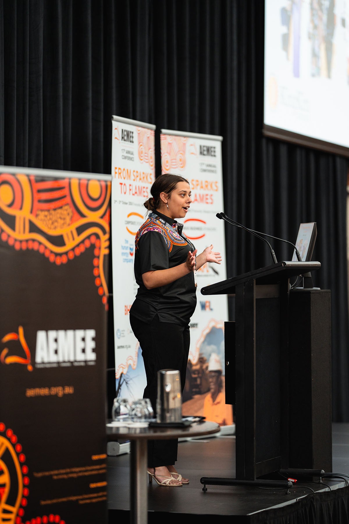 A presenter speaking from the microphone during an interactive technical stream panel exploring strategic opportunities in the Indigenous business resources sector.