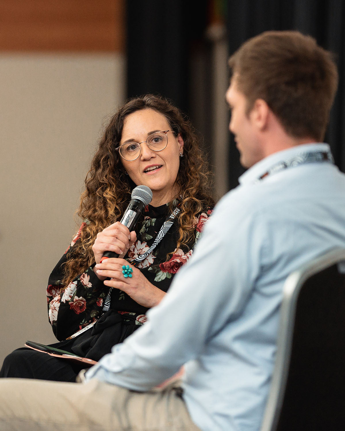 A close-up shot of a female presenter speaking during an industry breakout stream focused on structural growth within the Indigenous business resources sector.