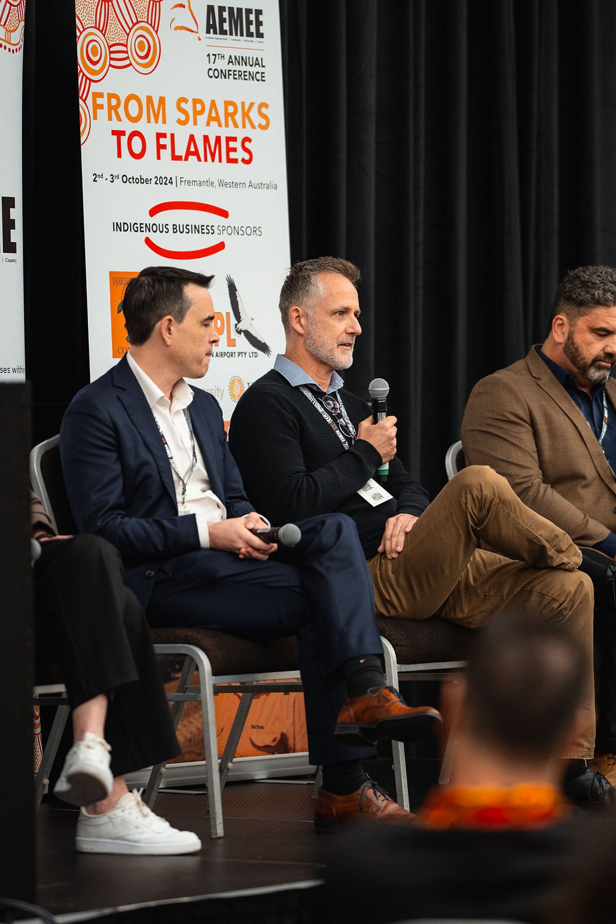 Rio Tinto representative Matt Plichta seated alongside joint-venture commercial partners during an interactive resource sector panel discussion at the AEMEE conference.