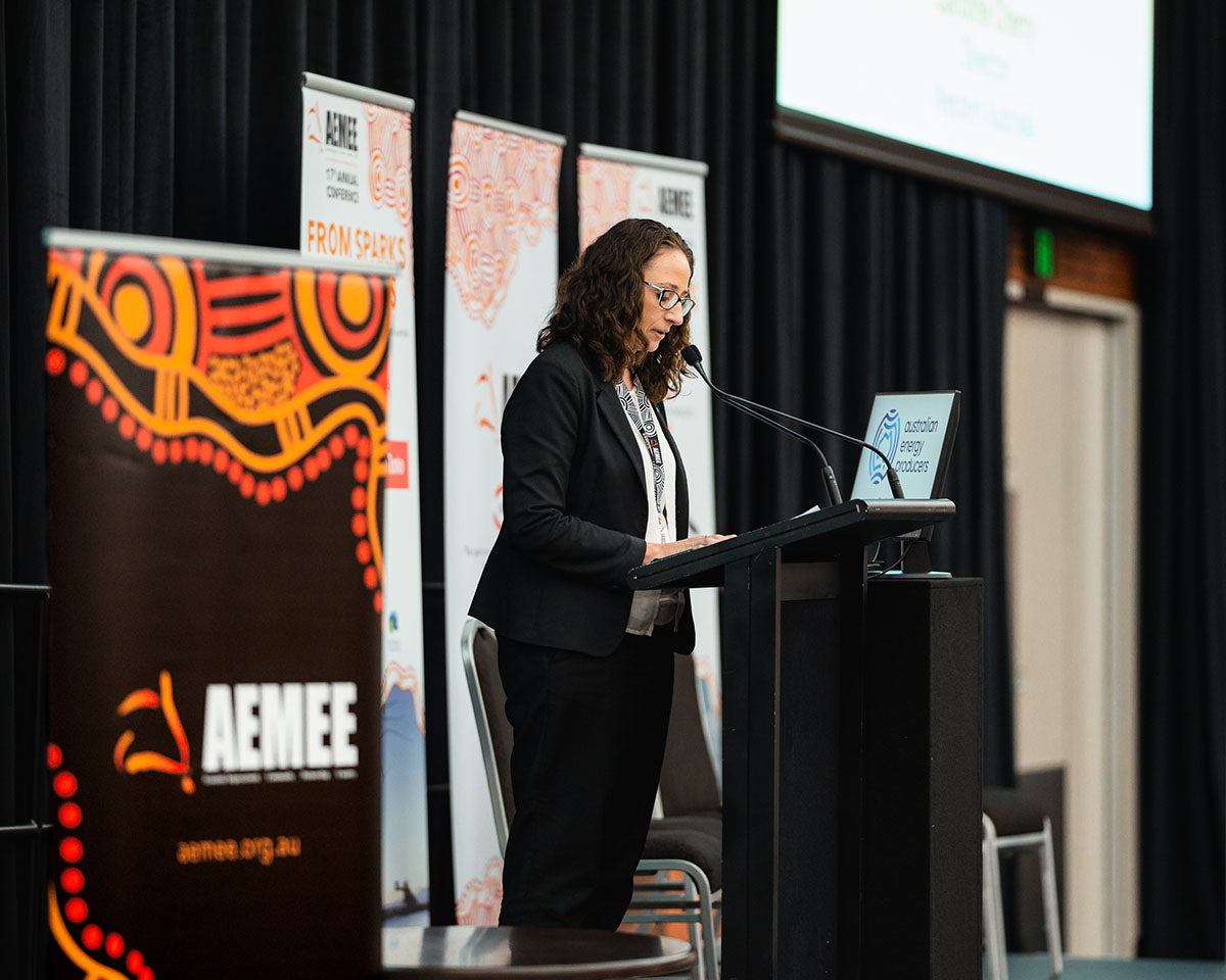 Caroline Cherry from Australian Energy Producers Western Australia looking at her notes while speaking at the podium during a resource sector development stream breakout.