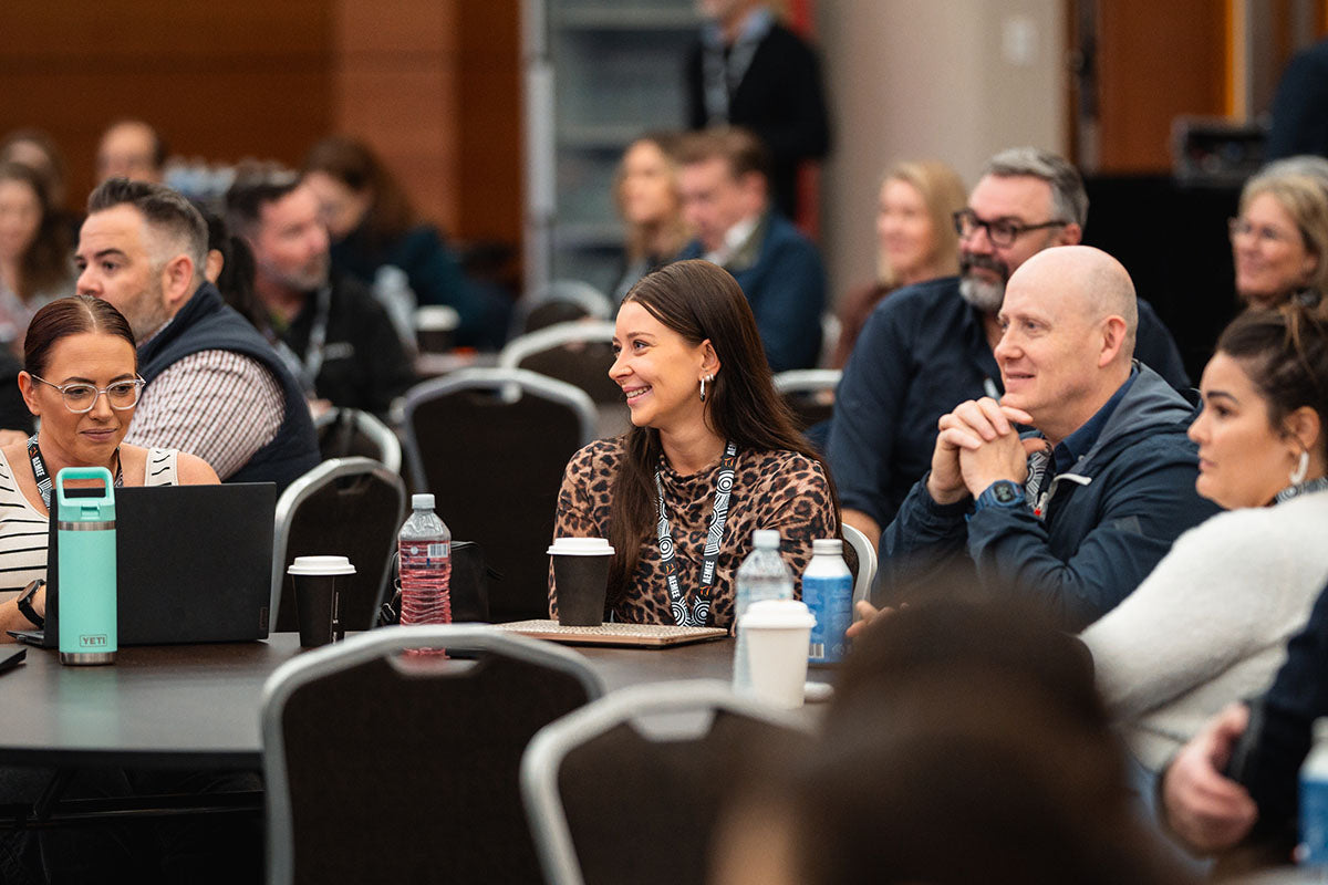 Seated business professionals listening closely during a resource sector development panel breakout at the annual national AEMEE conference.