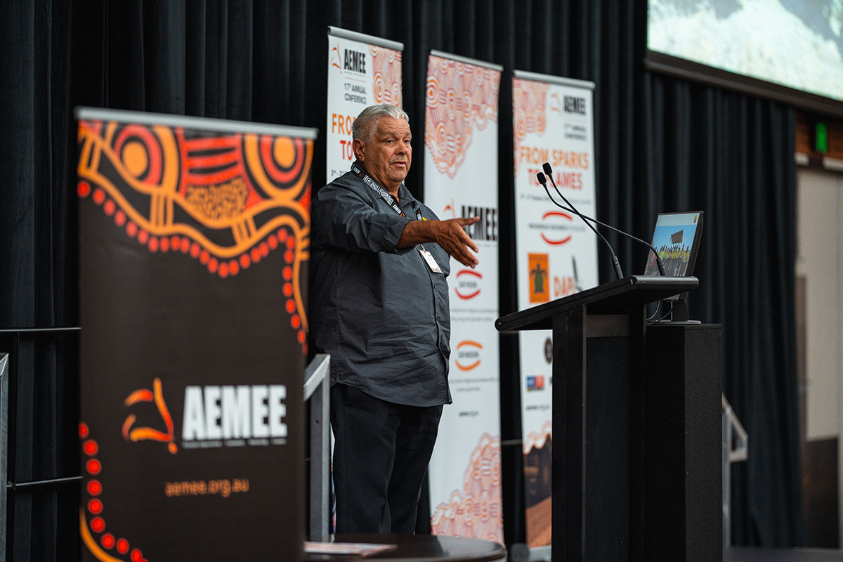 Industry delegates watching an active breakout presentation inside the main auditorium hall during a technical stream session at the annual AEMEE conference.