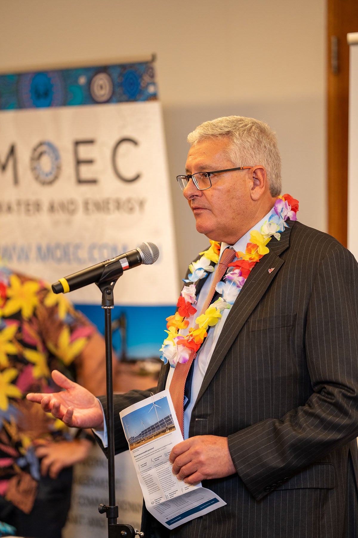 Close-up profile of a corporate sponsor representative giving an official speech during the 2024 AEMEE Networking Night sponsored by MOEC.