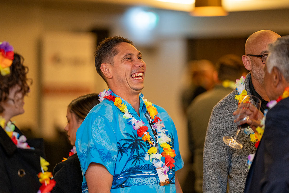 AEMEE CEO Jyi Lawton laughing during a high-energy conversation with delegates at the themed evening social function.
