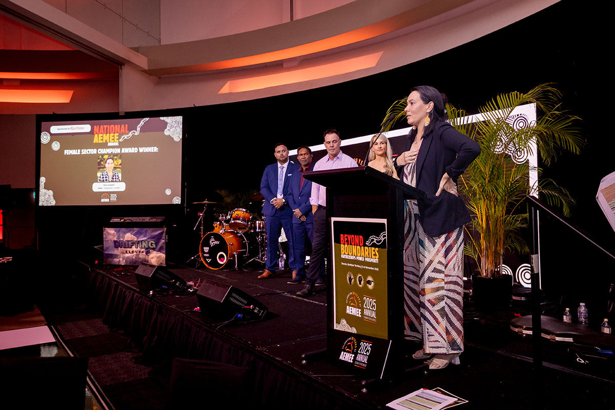Kia Dowell speaking at the podium during the National AEMEE Awards at the 2025 Annual Conference.