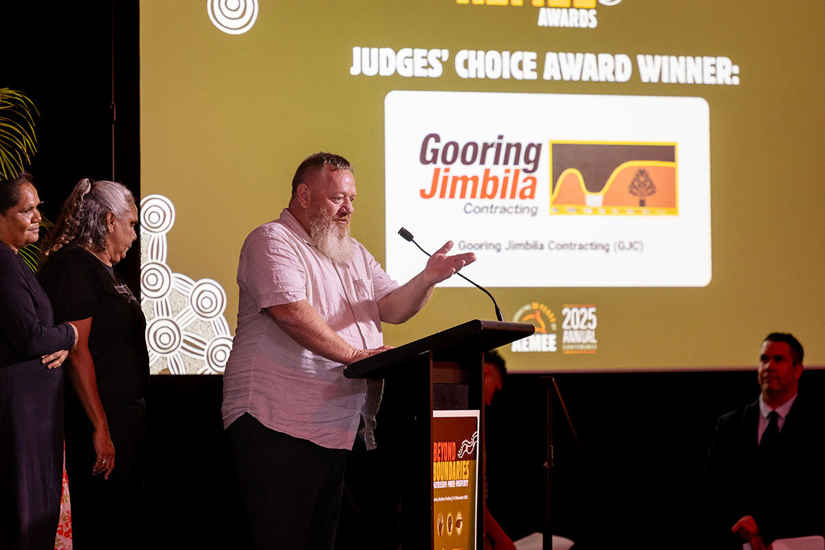 Gooring Jimbila Contracting representative speaking after winning the 2025 Judges' Choice Award at the AEMEE 2025 Annual Conference.