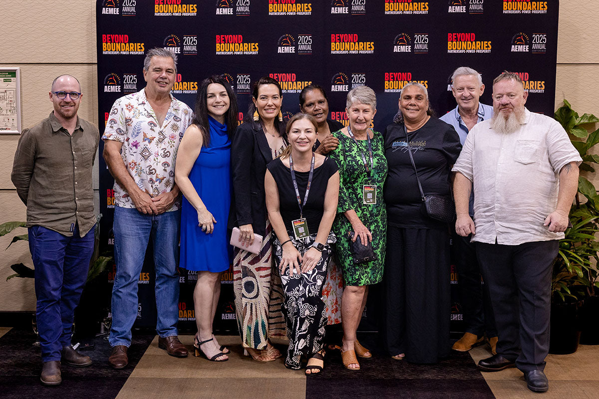 Group of delegates posing at the AEMEE 2025 National Resource Sector Awards gala dinner — Beyond Boundaries backdrop, Darwin