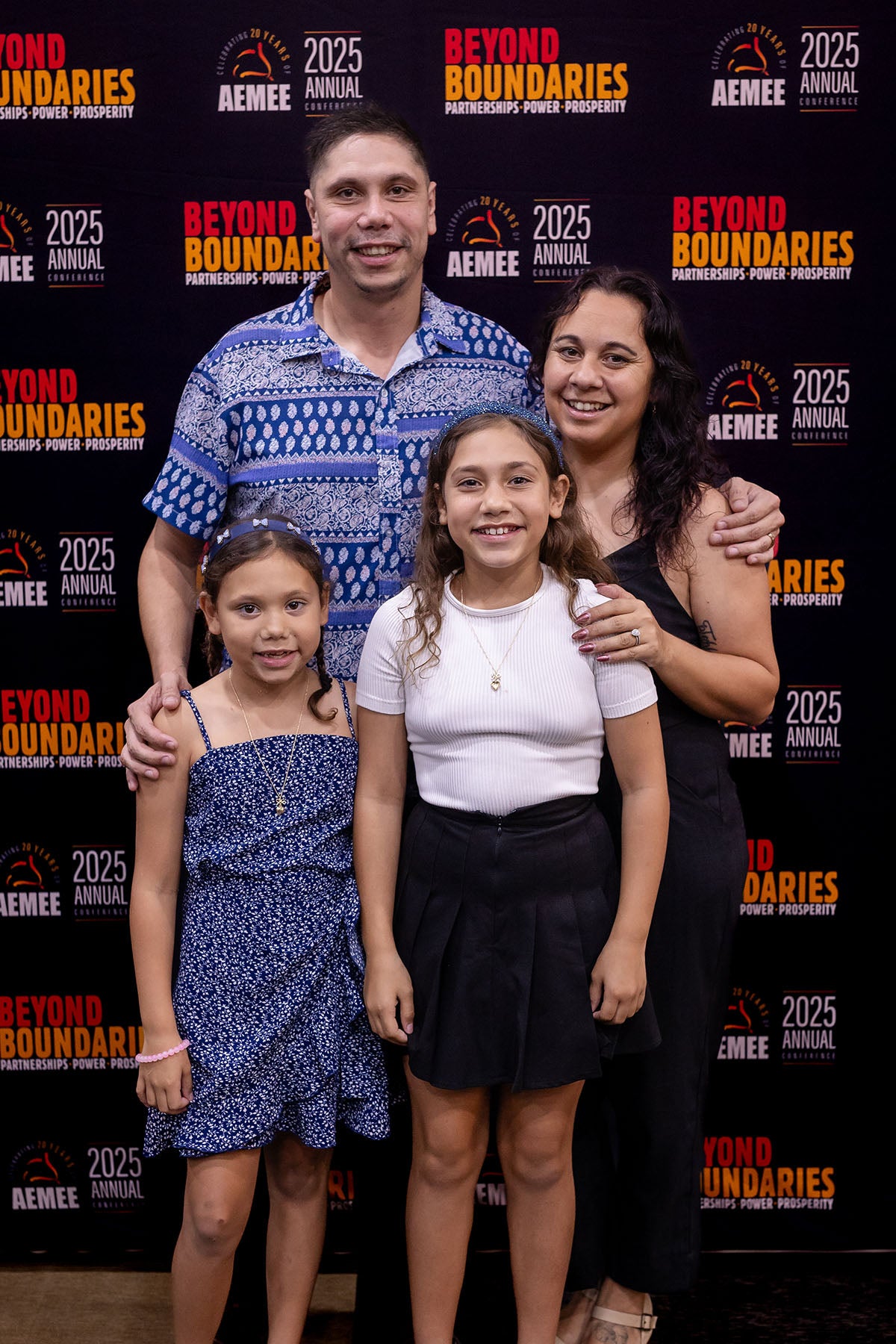CEO Jyi Lawton's family posing at the AEMEE 2025 National Resource Sector Awards gala dinner — Beyond Boundaries backdrop, Darwin