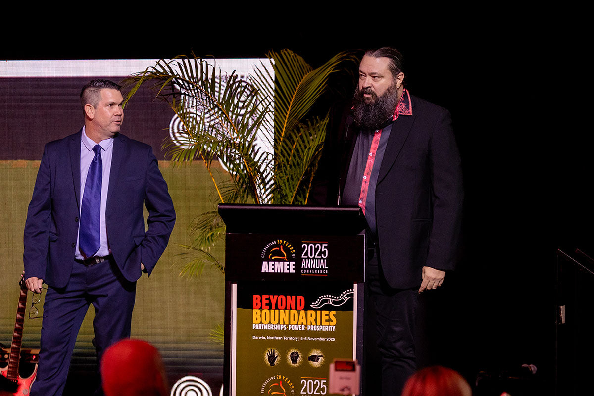 Speakers standing at the podium during the AEMEE 2025 Annual Conference Beyond Boundaries session.