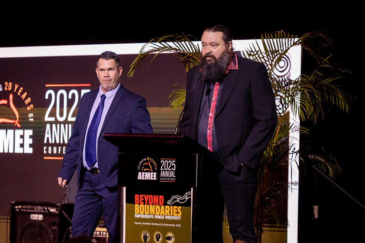 Presenters standing at the AEMEE conference podium during the 2025 Annual Conference.