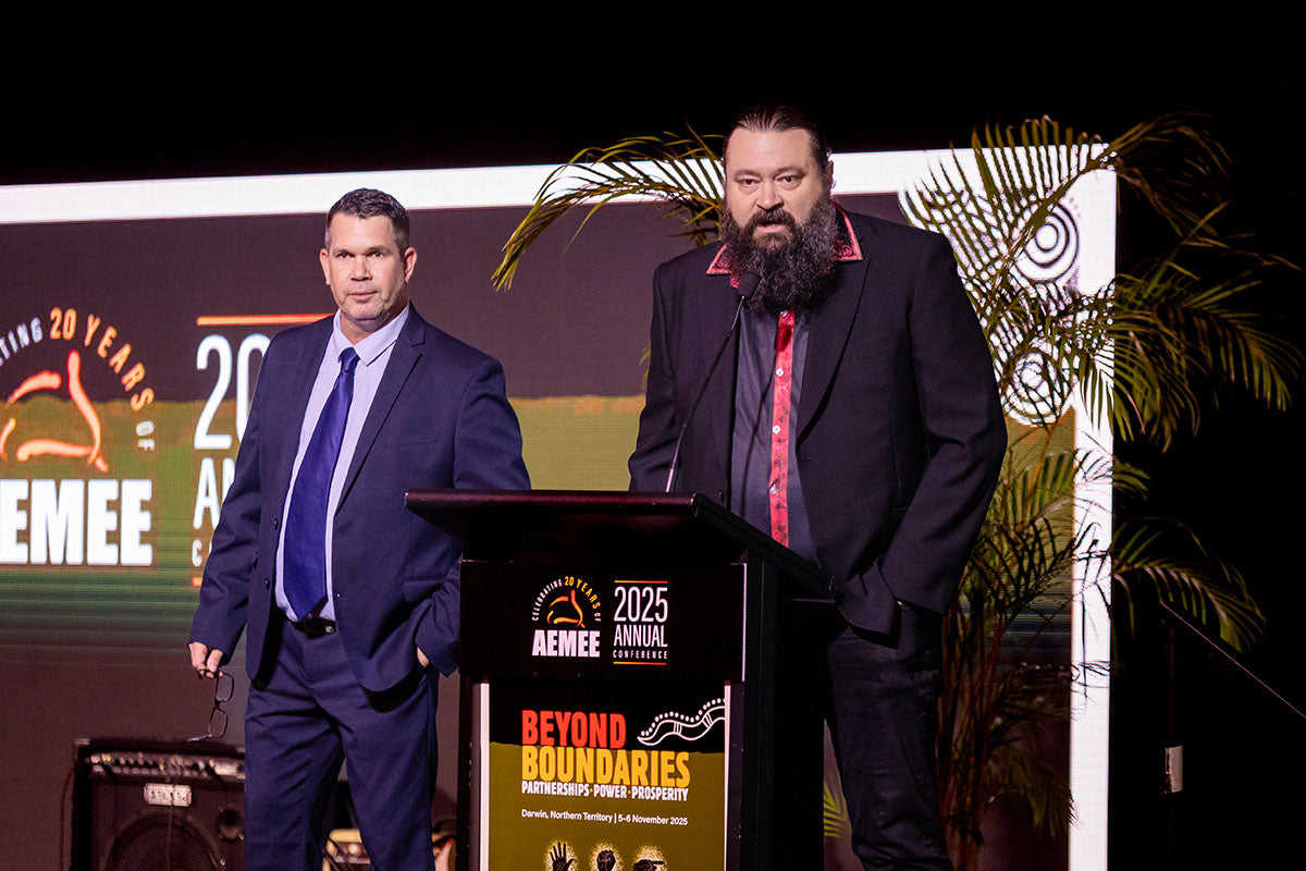 Speakers on stage at the AEMEE 2025 Annual Conference with Beyond Boundaries event branding.