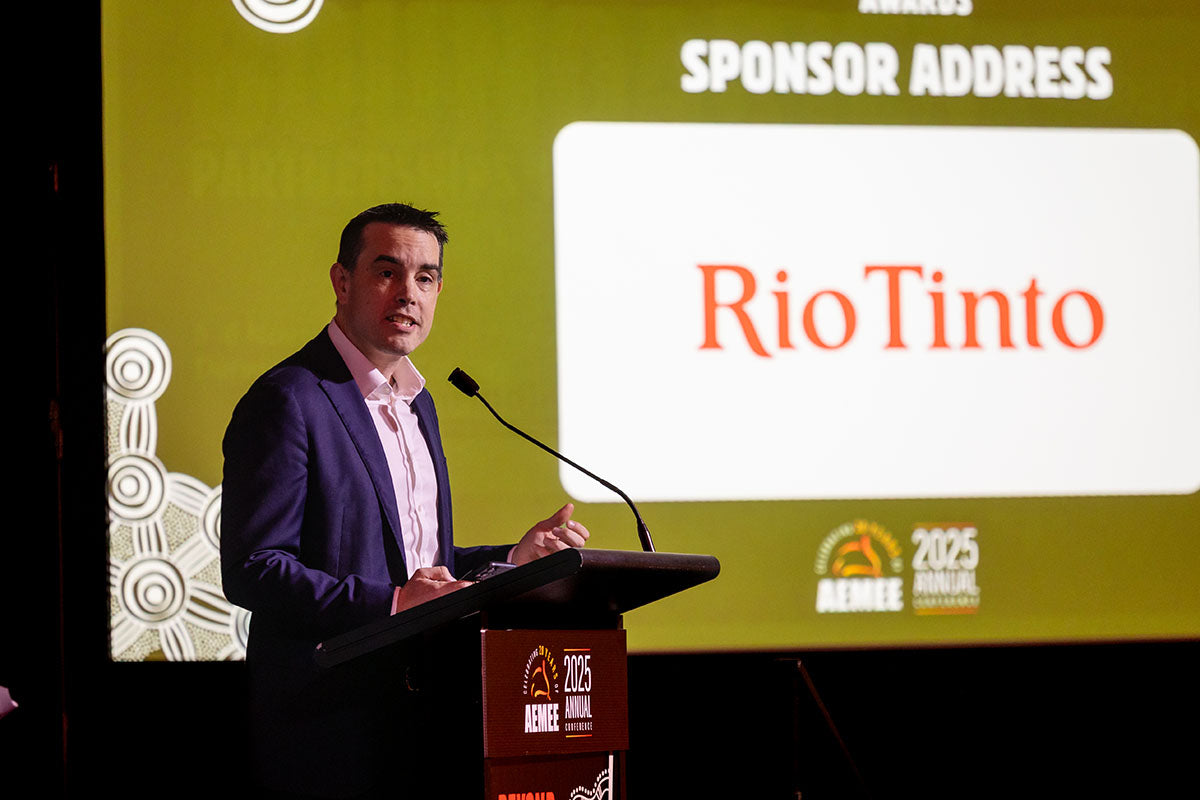 Speaker delivering a Rio Tinto sponsor address during the AEMEE conference.