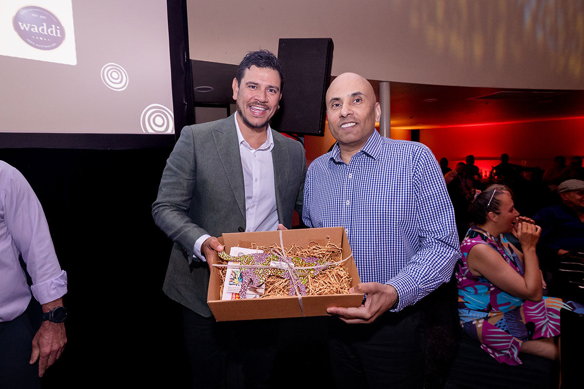 AEMEE conference guest receiving a gift box during the 2025 Annual Conference awards dinner.