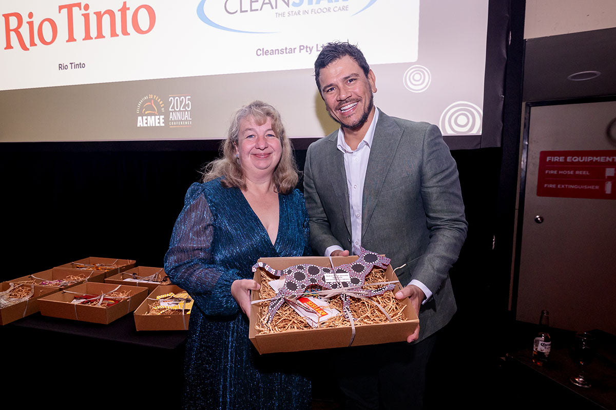 AEMEE conference guest receiving a gift box during the 2025 Annual Conference awards dinner.