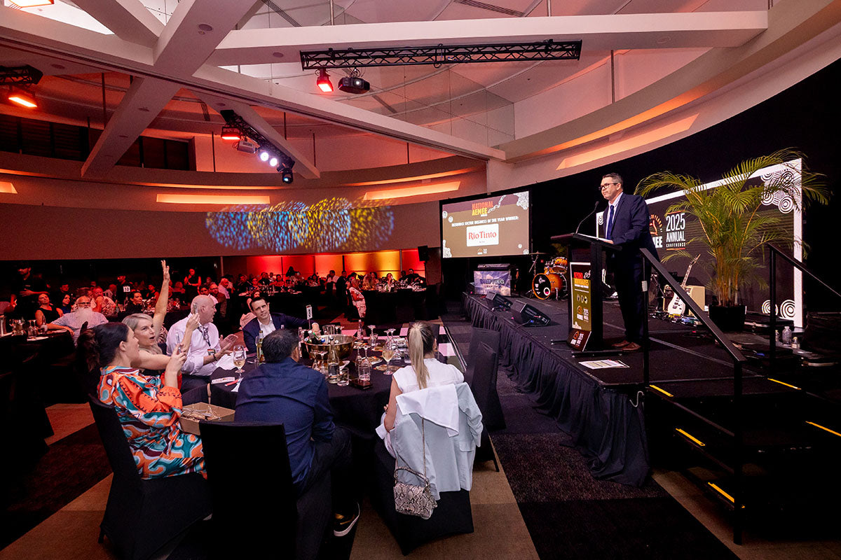Wide view of the AEMEE 2025 Annual Conference awards dinner during a sponsor presentation.