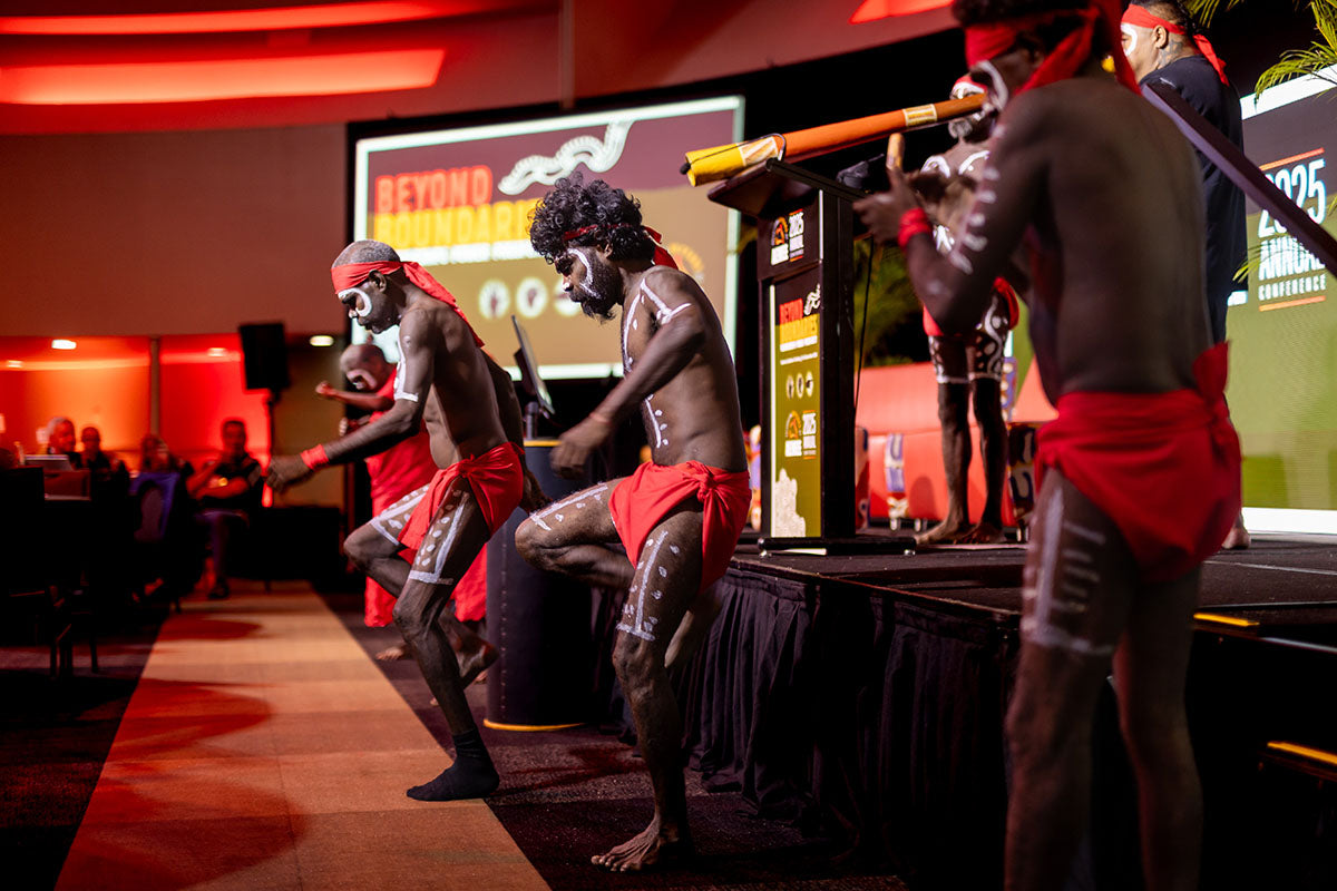 Traditional Indigenous dancers with body paint performing at the AEMEE 2025 Annual Conference Day 1, Darwin