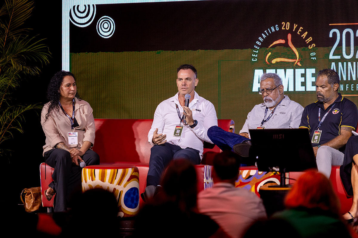 Four panellists in discussion on stage at the AEMEE 2025 Annual Conference Day 1, Darwin