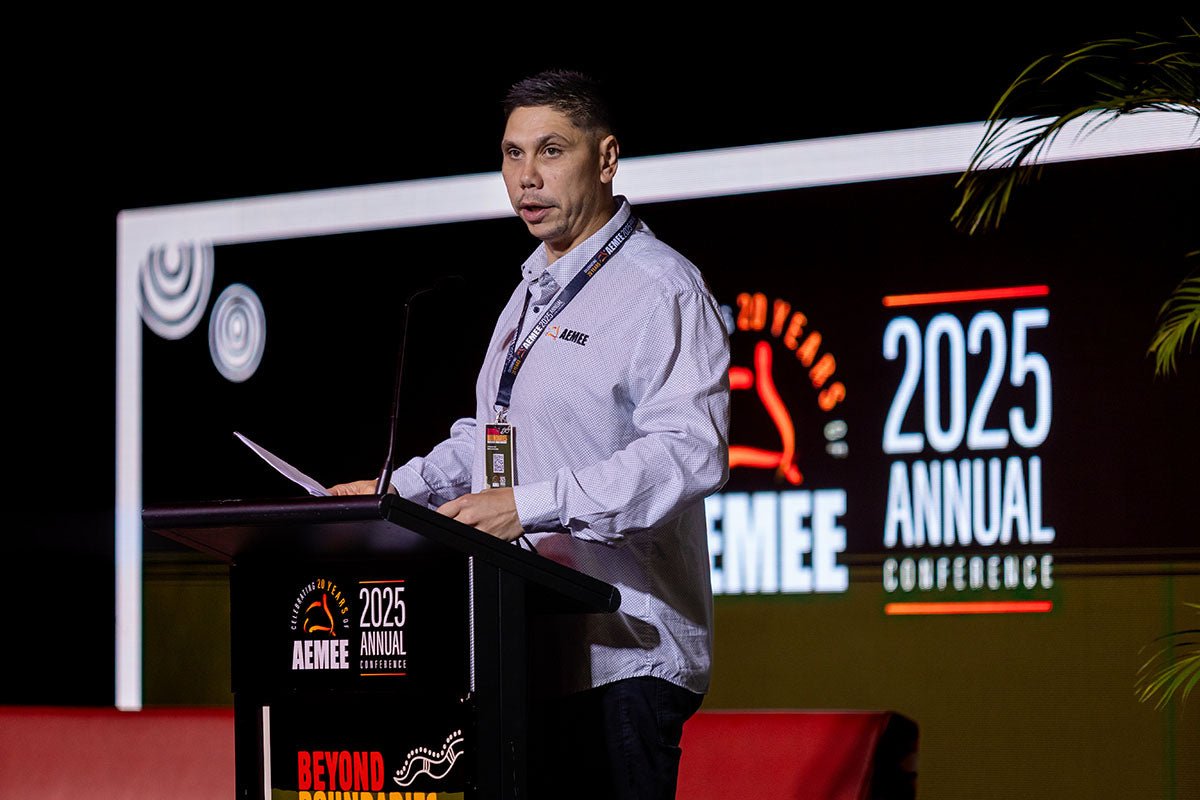 Speaker at the podium at the AEMEE 2025 Annual Conference Day 1, Darwin