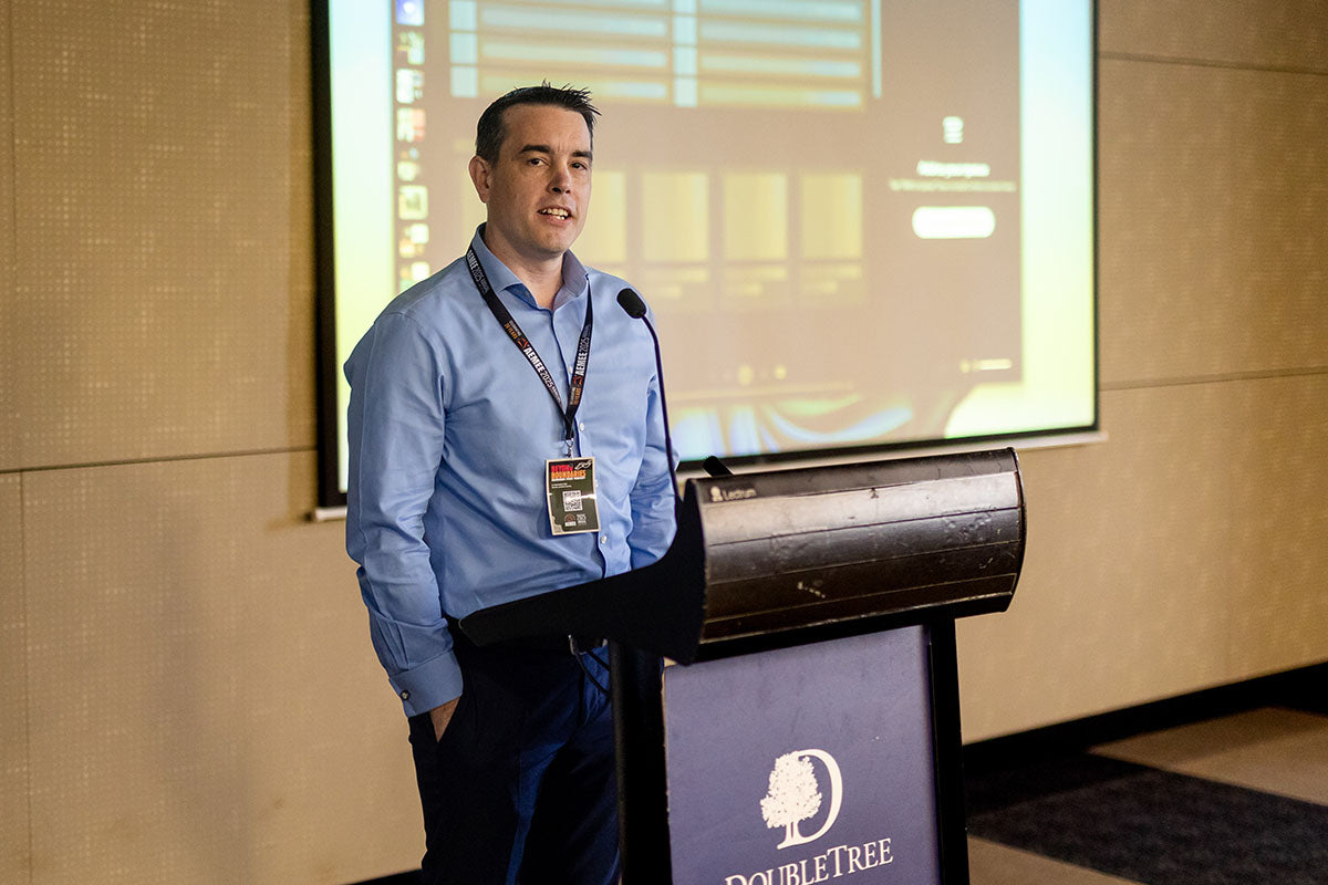 Presenter speaking at a conference session during the AEMEE 2025 Annual Conference.
