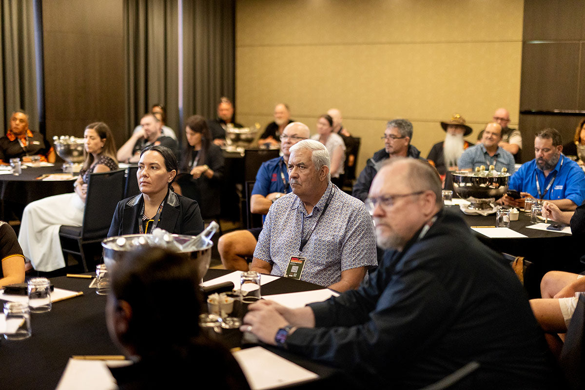 Delegates listening during an AEMEE conference session focused on Indigenous business and resources sector impact.