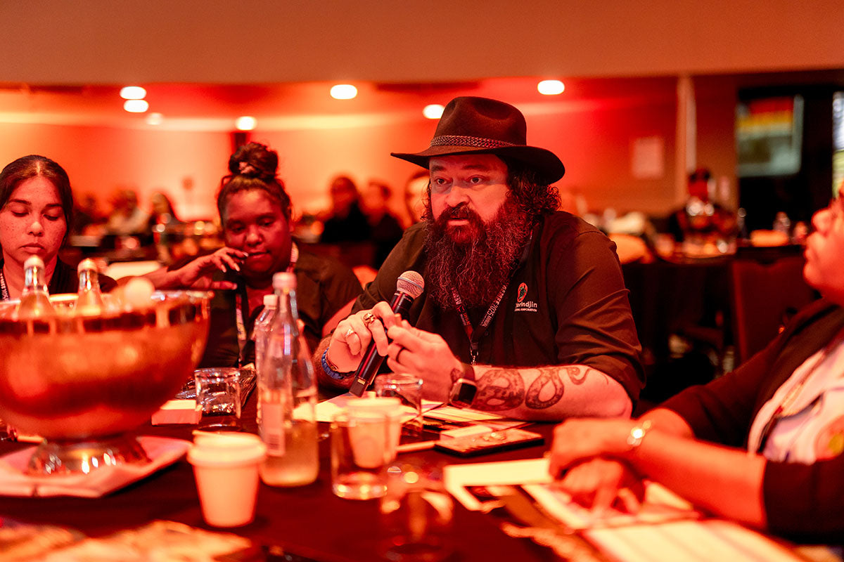 Delegate speaking during an AEMEE conference roundtable discussion on Indigenous business and resources sector collaboration.