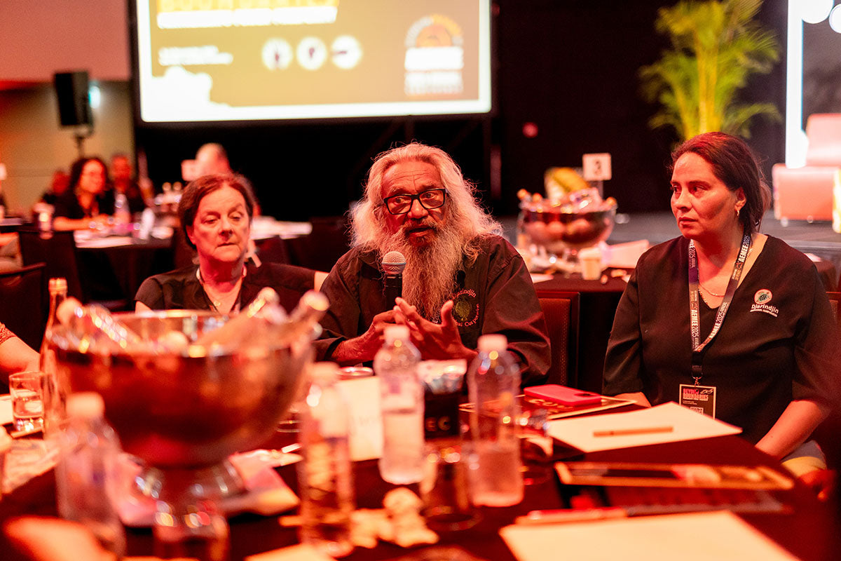 Delegates participating in an AEMEE conference roundtable discussion on Indigenous business leadership and collaboration.
