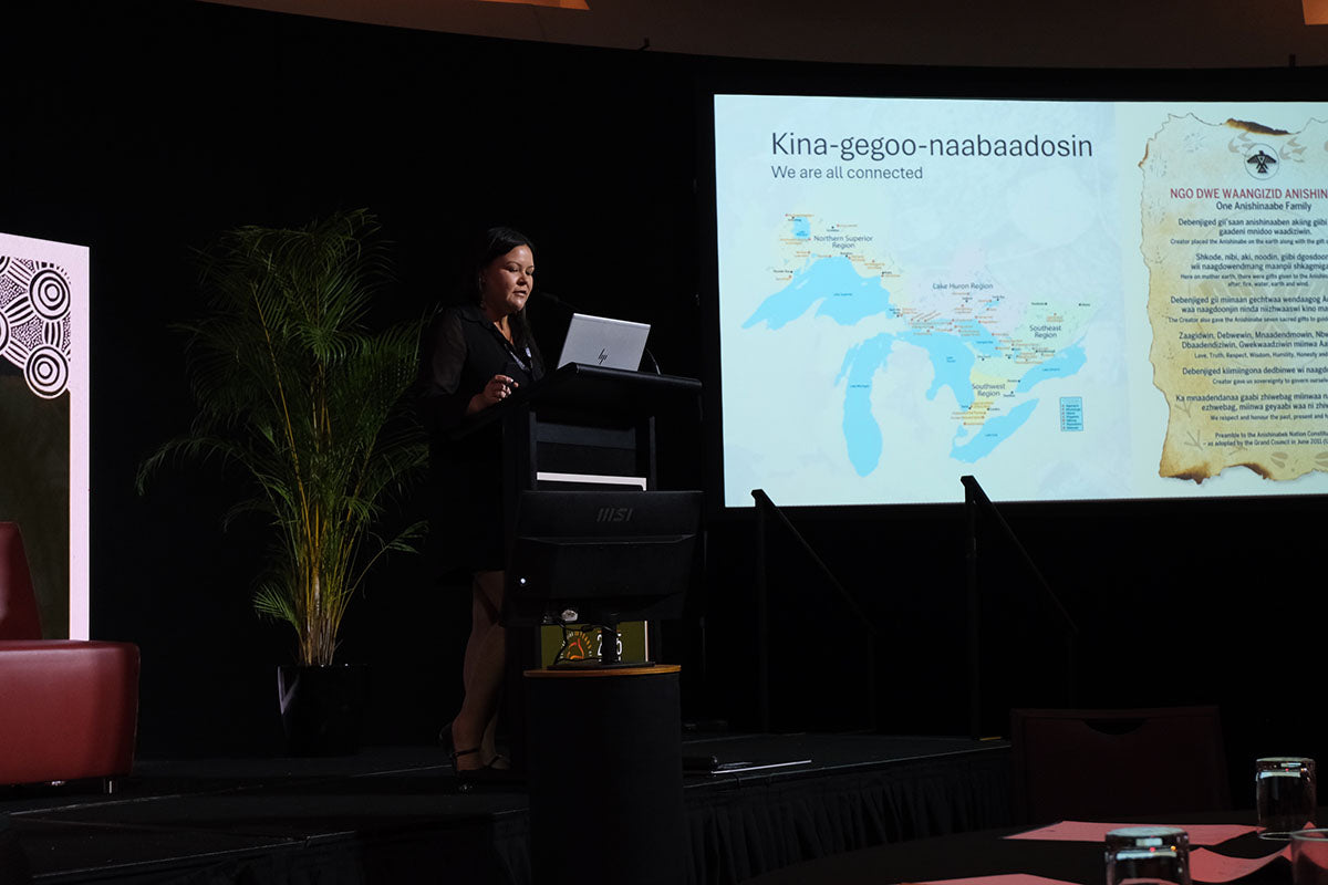 Presenter sharing a map during an AEMEE conference session on Indigenous business, culture and connection.