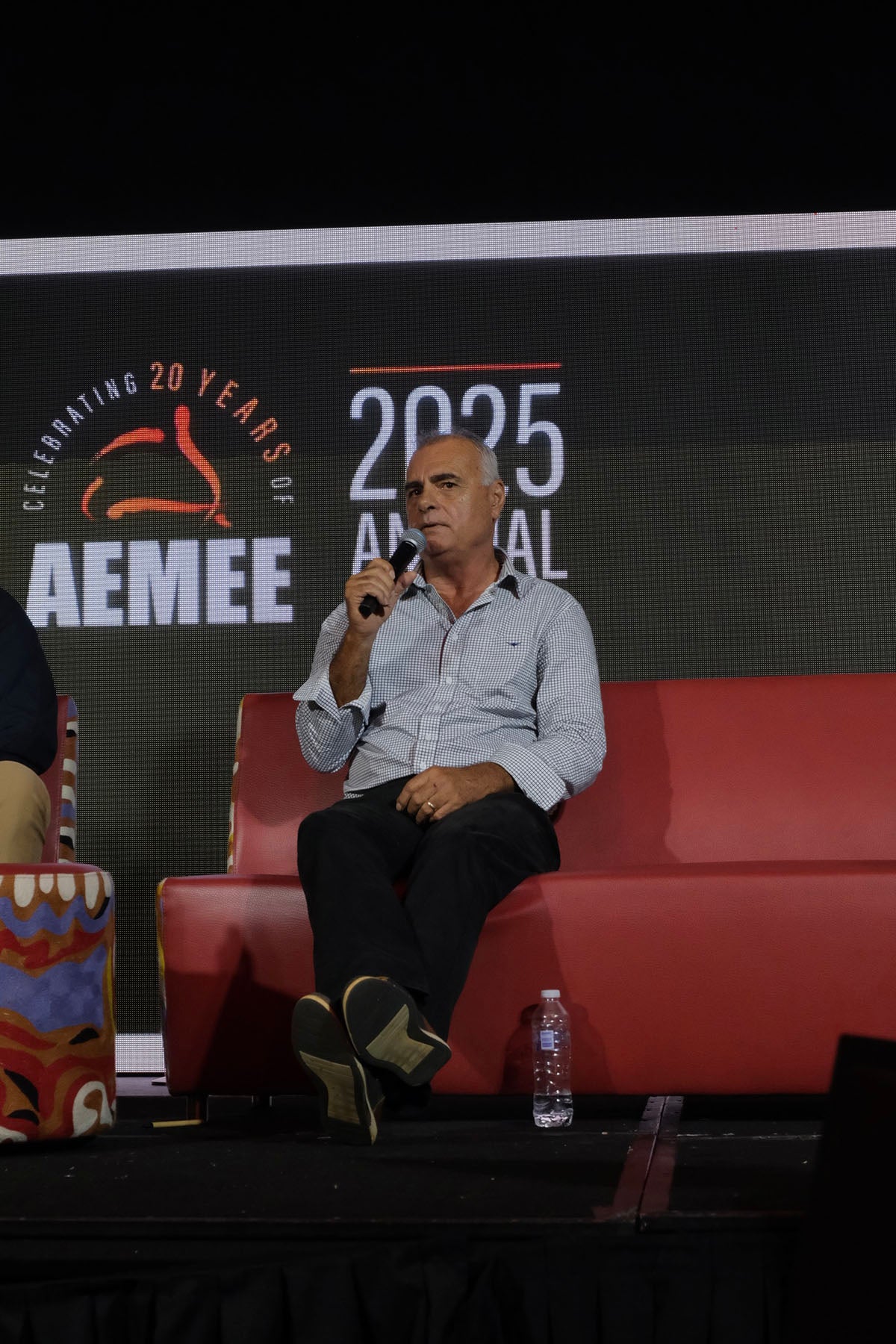 AEMEE conference speaker sharing insights during a resources sector panel discussion.