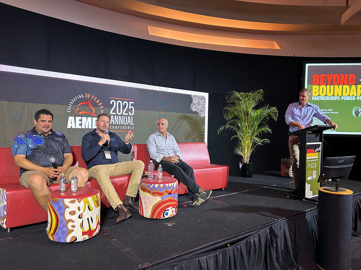 Panellists and presenter on stage at the AEMEE conference during an Indigenous business resources sector session.