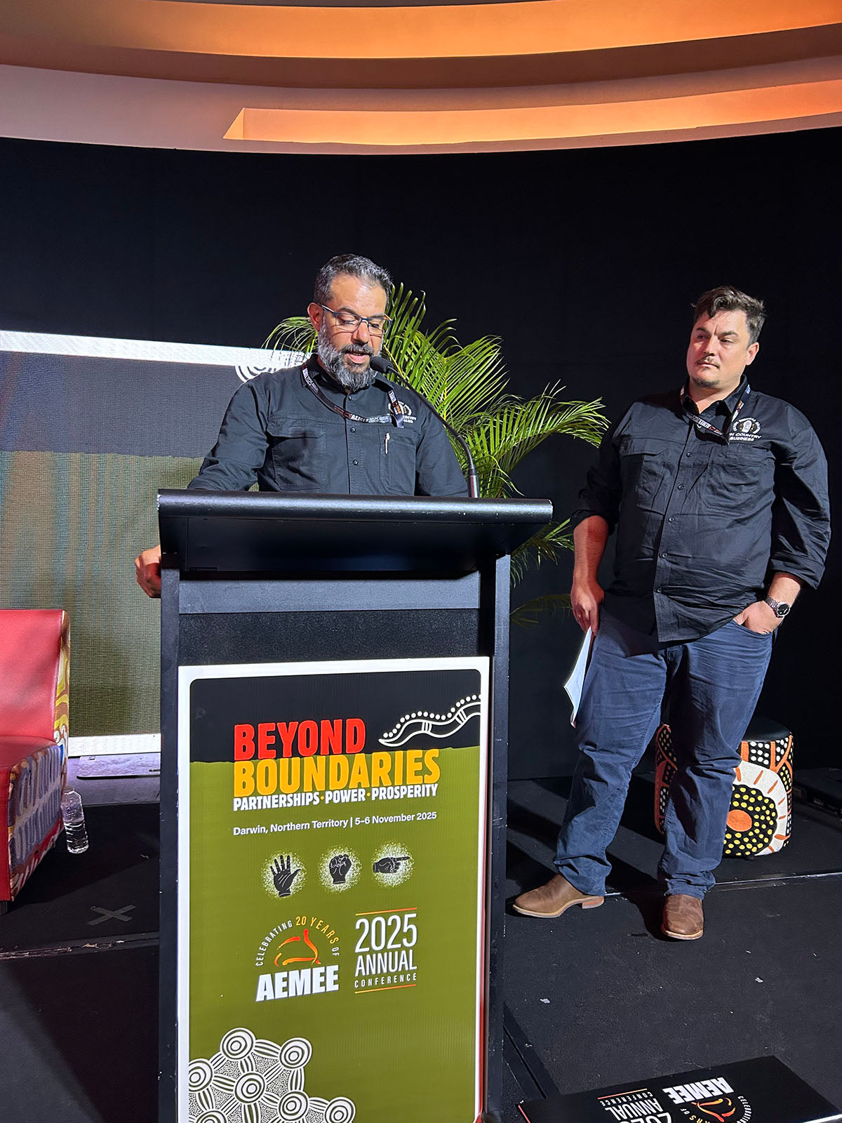 Speakers presenting at the AEMEE conference podium during the 2025 Annual Conference.