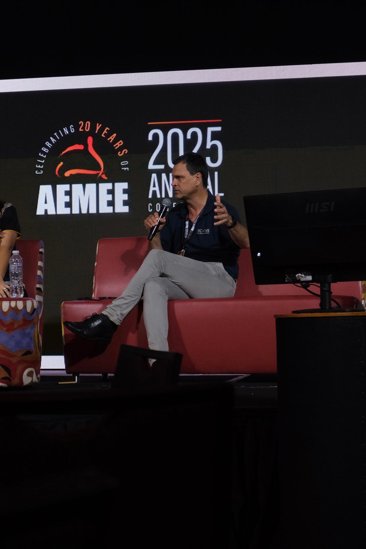 AEMEE conference panellist speaking during a discussion on Indigenous business leadership and collaboration.