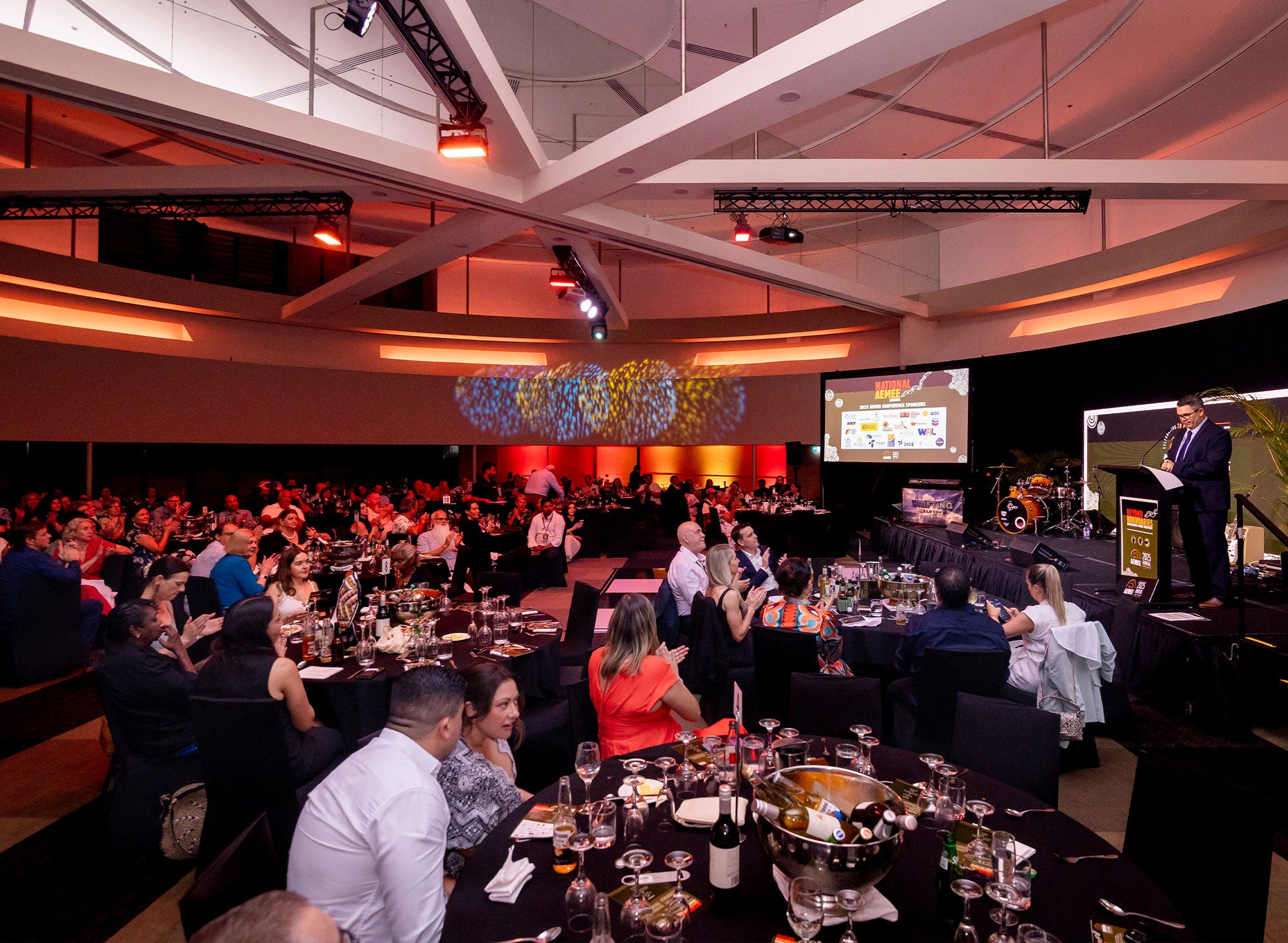 Large scale ballroom setting at the AEMEE National Conference, featuring industry leaders and Indigenous business owners celebrating excellence in the resources sector.