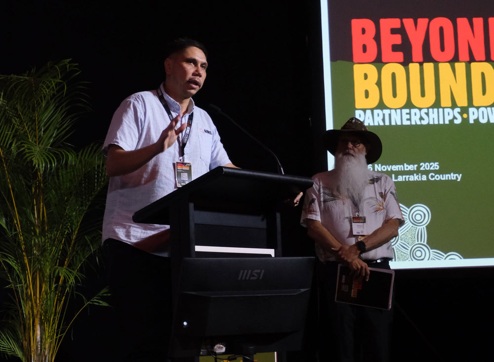 AEMEE Chief Executive Officer Jyi Lawton delivering a keynote address alongside a community leader at a national resources and advocacy forum on Larrakia Country.